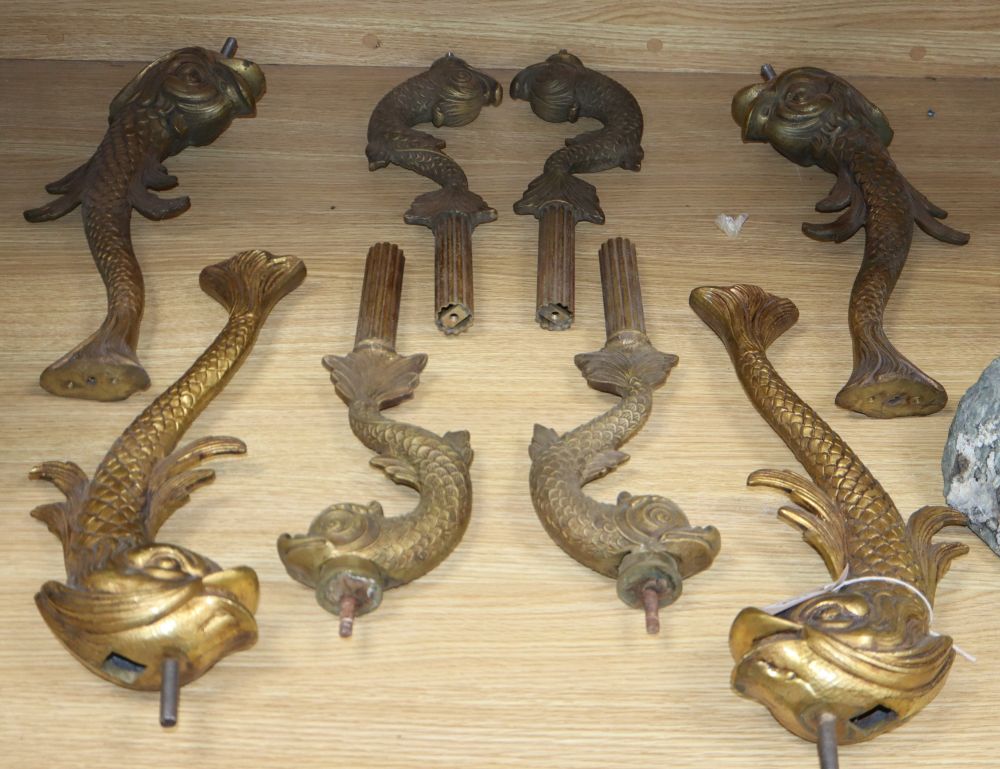 Two sets of four gilt metal dolphin supports, longest excluding screw thread 39cm